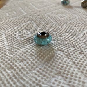 Pandora light blue sea glass charm.
